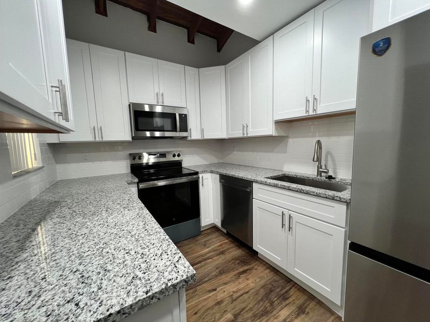 Updated  Spacious 2 story townhouse in small quiet community. Beautiful LVP floors throughout. White kitchen cabinets with Granite counter tops, New SS Appliances and Recessed lighting.  New blinds and entirely just painted. Guest/Half bath downstairs. Full size washer/dryer.  Two Large Primary Bedrooms both with Walk-In Closets and full baths.  Large Court yard with screened in patio  Storage closet downstairs. Conveniently located to Shopping, Parks and restaurants in close proximity.   Beautiful Townhome in the heart of coral springs.