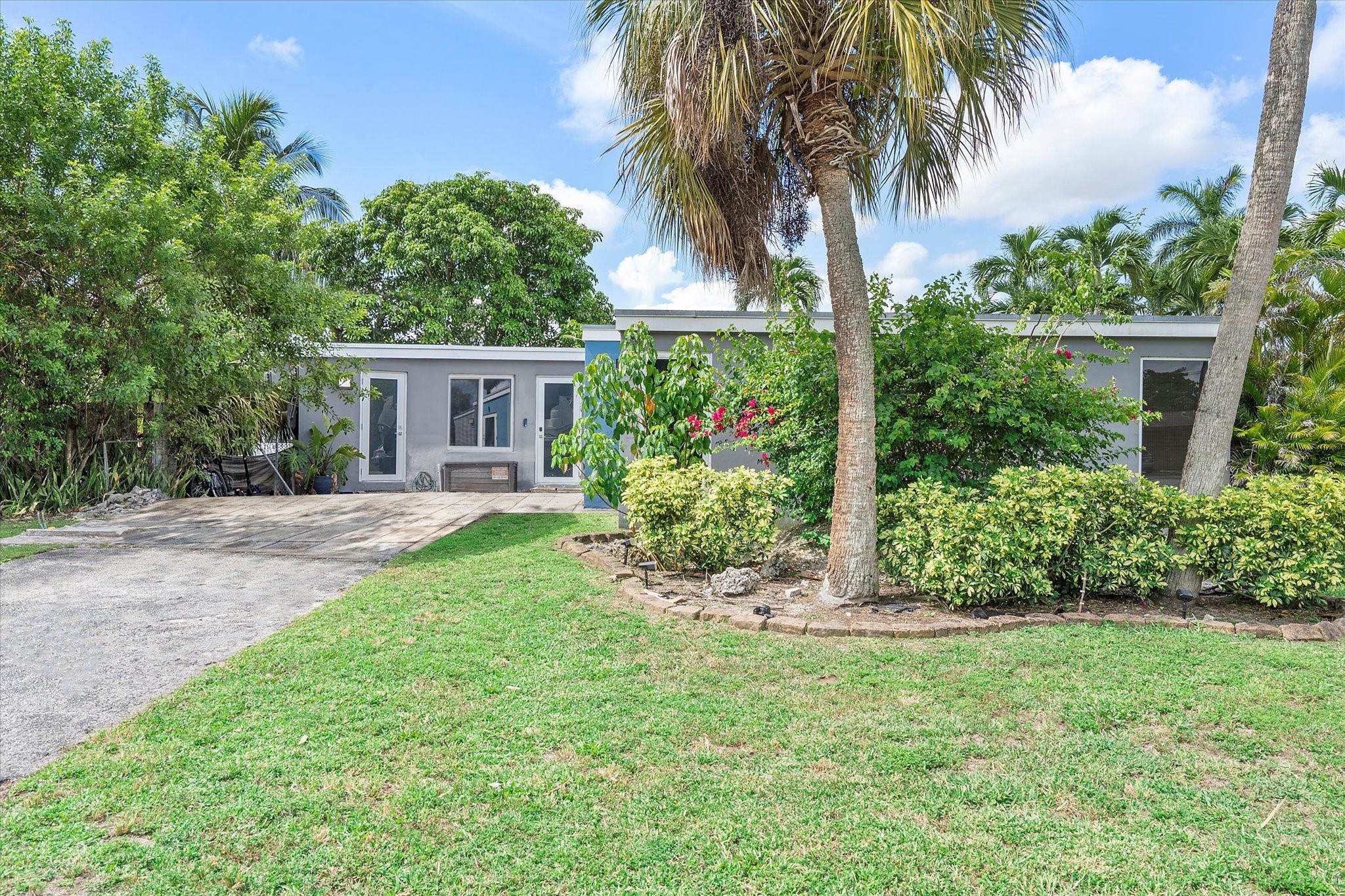 Renovated SMART home featuring 3 bedrooms, 2 baths, and impact windows and doors. Enjoy vinyl flooring throughout and in-home laundry. Both bathrooms offer spa-like walk-in showers with sleek panel systems featuring multiple shower heads. The design is low-maintenance, with tile extending 3/4 up the walls. A private split-bedroom floor plan adds functionality and comfort. The fenced backyard overlooks a peaceful canal and includes an open patio. With no HOA fees or restrictions, this property offers flexibility and freedom. Conveniently located near parks, schools, shopping, dining, and major roadways, this home combines comfort, privacy, and everyday ease in a welcoming community.