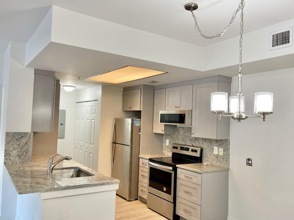 Photo of 2814 Grande Parkway #105, Palm Beach Gardens, FL 33410 (MLS # R11077631)