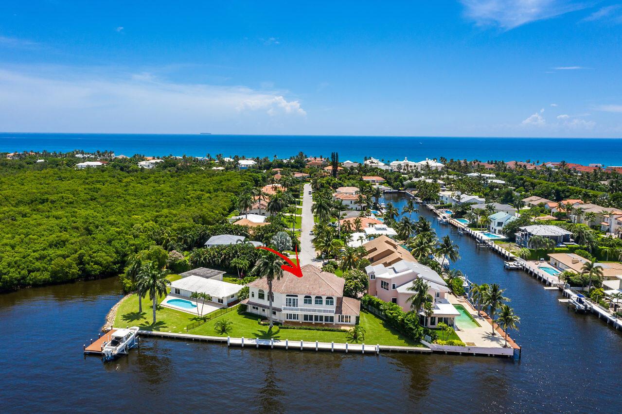 Beautiful direct Intracoastal estate & dock on cul-de-sac point lot with 165 feet on the ICW. 24,000 lb lift can accommodate up to 38' boat. Dramatic two story living area with an open floor plan centered around a chefs kitchen. Upstairs there is an oversized master suite and sitting area/office. 2 huge walk-in closets and a master bath with a magnificent shower and tub over looking the Intracoastal. Just a short walk to the beach and minutes by boat to the Boynton Beach Inlet. There is fine dining across the Woolbright Bridge and only 4 miles to downtown Delray Beach and 20 minutes to Worth Avenue, both areas offering world class shopping, nightlife and dining.