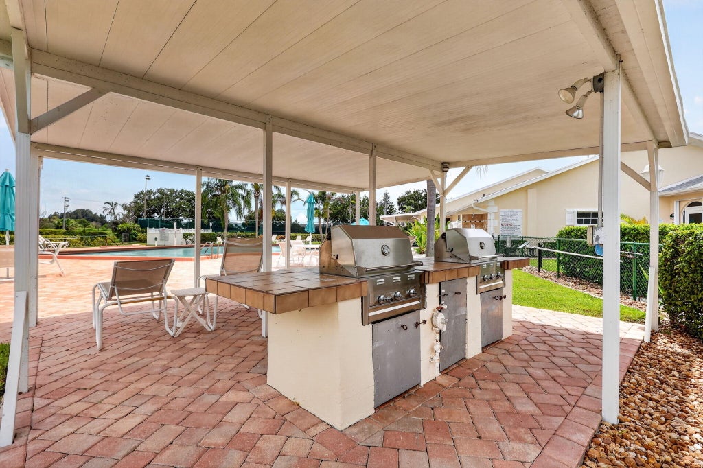 Photo of 873 LAKE ORCHID Circle, Vero Beach, FL 32962 (MLS # B26060786)