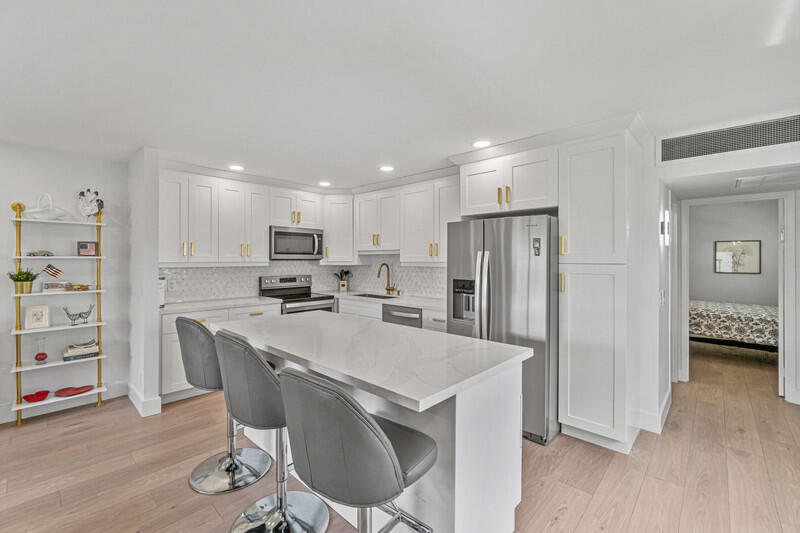 Turnkey and completely renovated 1/1.5 plus enclosed Florida room in Valencia section of Kings Point. This apartment shows like a model with a gorgeous white kitchen with large island, quartz countertops, and stainless steel appliances. Luxury vinyl flooring throughout, two renovated bathrooms, smooth ceilings, and lots of windows with natural light. Tastefully furnished and available at anytime for a 6 month minimum (as per association).