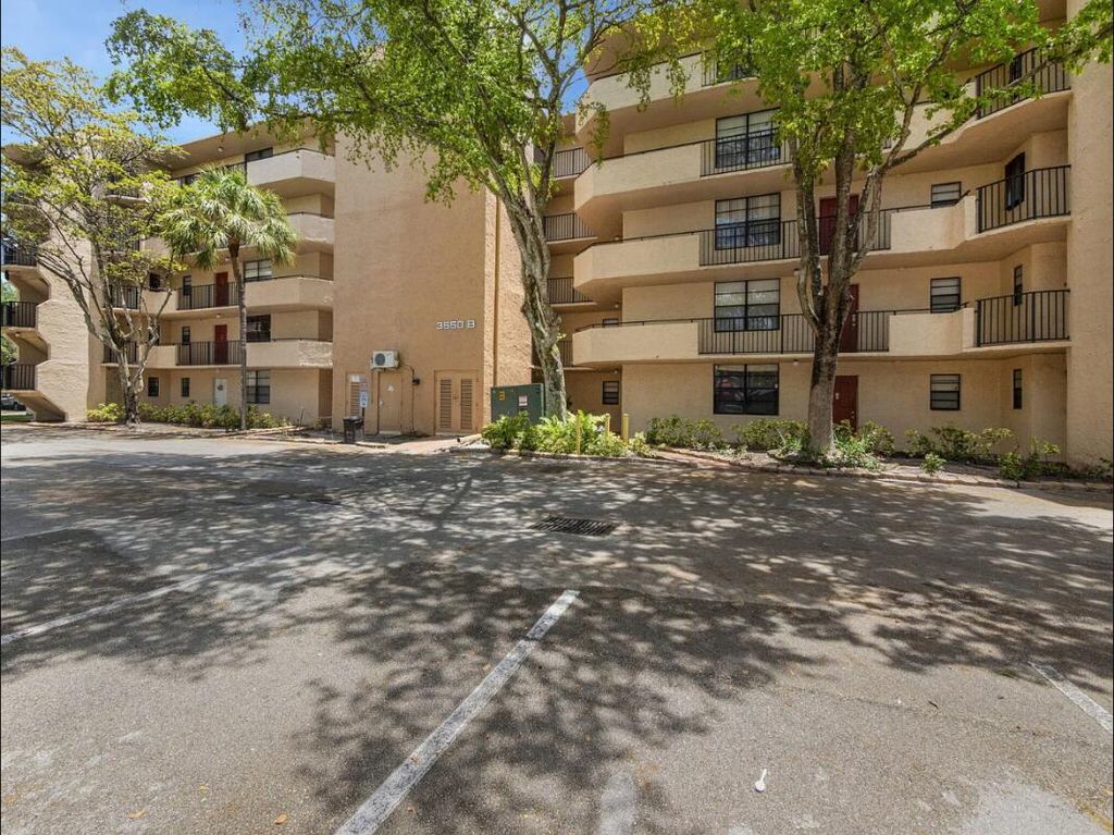 Photo of 3550 Blue Lake Drive #404, Pompano Beach, FL 33064 (MLS # B26004854)