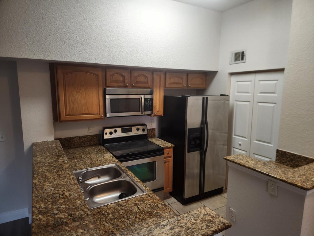 Photo of 241 SW Palm Drive #306, Port Saint Lucie, FL 34986 (MLS # B26075493)