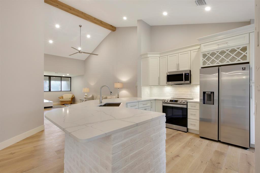 Enjoy paradise in this beautiful contemporary 2bedroom/2bathroom condo with one car garage at highly desirable community in Juno Beach. This spectacular vacation home has been completely remodeled with beautiful upgrades and all the modern luxury comforts. Hardwood floors and ceramic tile throughout. Large living area with vaulted ceiling leads to the kitchen and breakfast nook. In addition a separate dining area. The gourmet kitchen features stainless steel appliances and quartz counter tops. Motorized custom blinds in Master and Guest Bedrooms. Hurricane Windows installed recently. Seasonal rent includes water, internet , cable, and also electricity up to $100.