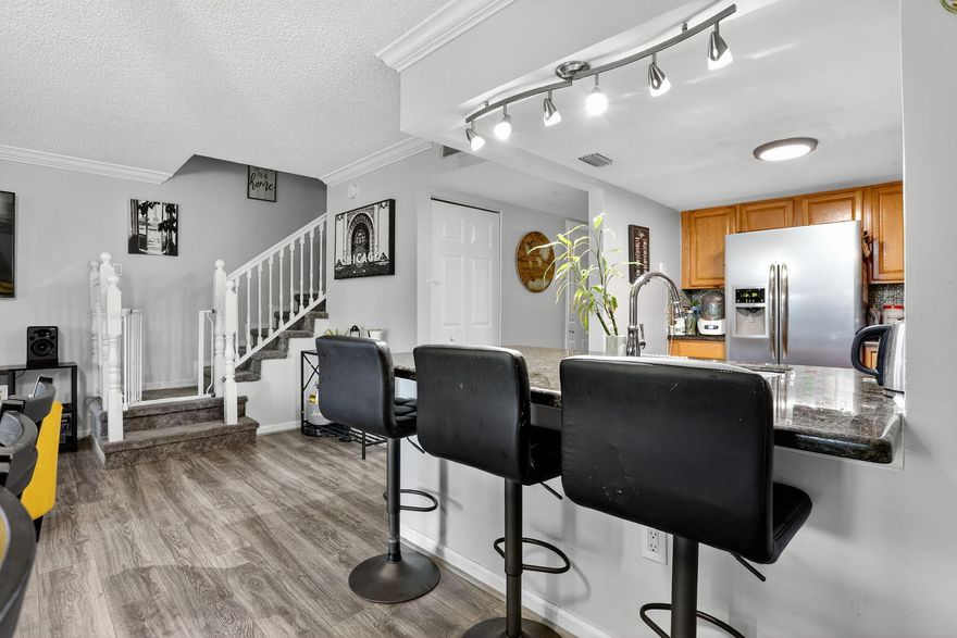MOVE IN READY!! RENOVATED 3-Bedroom, 2.5-Bathroom Townhouse in Coral Springs. This beautifully updated townhouse features NEW FLOORING, 2023 ROOF. The kitchen boasts granite countertops, a built in water filtration system, and 2023 stainless steel appliances. The master suite includes a private balcony! Additional upgrades are  2024 AC, 2023 water heater, 2023 washer/dryer, and HURRICANE IMPACT WINDOWS AND SLIDERS (2023). The screened-in porch overlooks a peaceful canal and grassy area, perfect for outdoor grilling. Community amenities include a private pool and hot tub, and HOA fee covers water. Located near schools, dining, shopping, and Coral Square Mall. 10% down & 650 credit score required. Schedule your showing today!