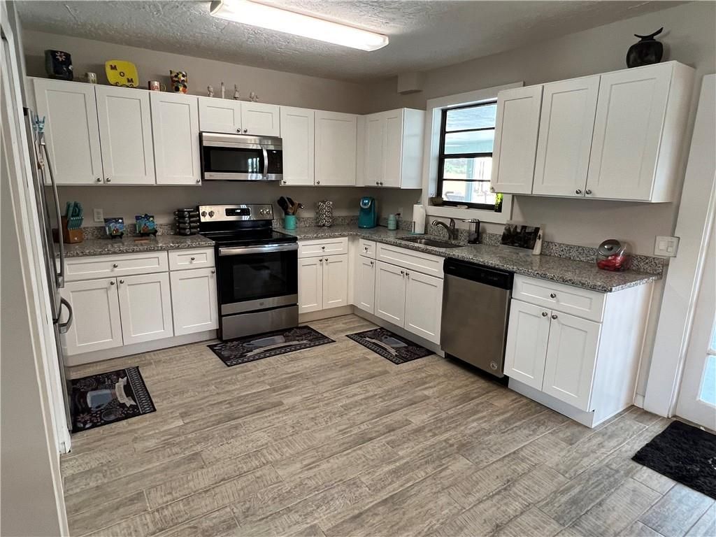Photo of 913 SE Browning Ave Ave, Port Saint Lucie, FL 34983 (MLS # F10336952)