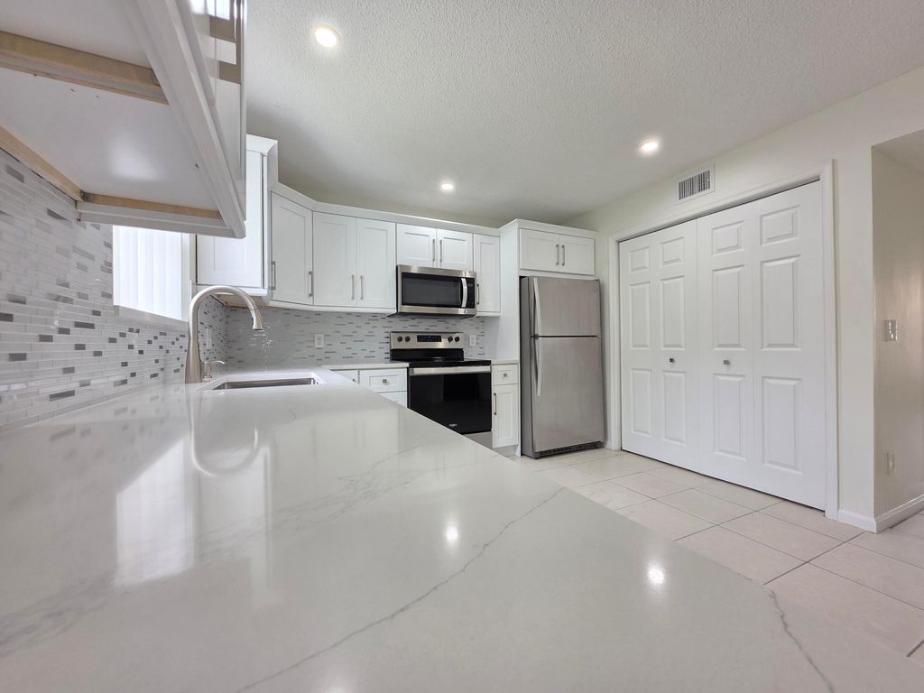 Photo of 5954 Longbow Lane, West Palm Beach, FL 33415 (MLS # B26014378)