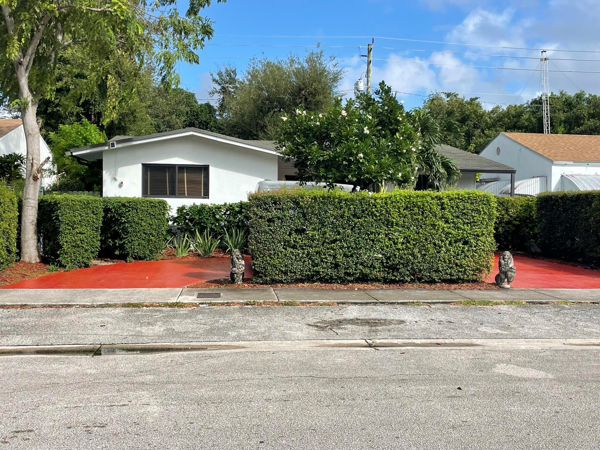 919 NW 47th Ter, Miami 33127 -- Updated 3BR/3BA home on a 5,000 SF lot (1,376 SF). Modern kitchen with stainless Samsung appliances, renovated baths, ceiling fans throughout. Versatile layout includes private in-law/studio 1BR/1BA with separate laundry -- ideal for multigenerational living or rental income. Outdoor highlights: covered patio, garden, fish pond and circular driveway. Move-in ready, excellent Miami investment or owner-occupied opportunity -- schedule your showing today.