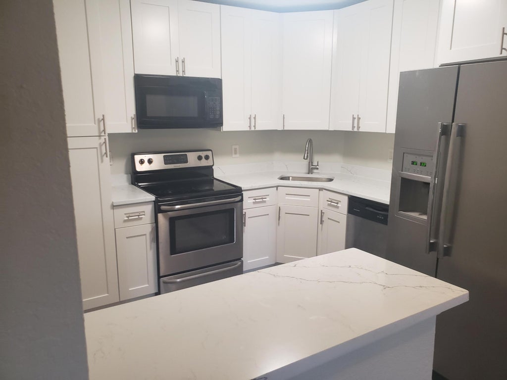 Photo of 3860 Coral Tree Circle #108, Coconut Creek, FL 33073 (MLS # B26041664)