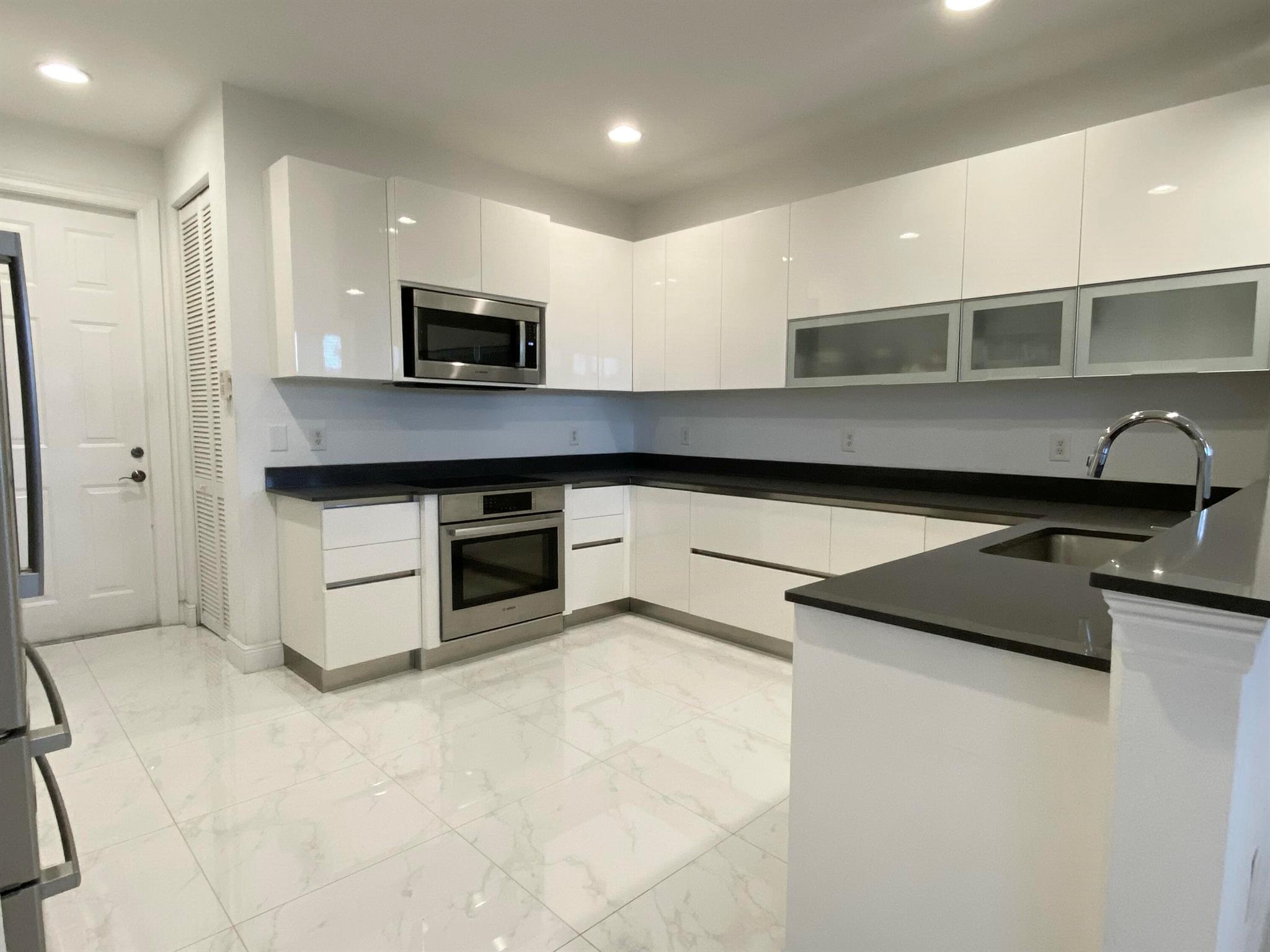 Immaculate & renovated top to bottom! 3 Bed / 2.5 Bath, 2 level home, with 2 car garage. Tile & LVP wood floors, European sleek white cabinetry & Bosch appliances. All updated lighting, fans, doorknobs & fixtures. Marble baths & rainfall showers, gorgeous bath vanities & countertops. All bedrooms are on upper level, with living area on entry level. En-suite primary bed/bath. Walk in closets. Full size laundry room. Private garage. CBS & Impact glass. CitySide is a gated community of 375 homes, minutes to I95, Target, Whole Foods, Outlet Mall, Restaurants & more. CitySide offers residents on-site mgmt, 24hr security, new gym, clubhouse, lake jogging trail & the biggest pool in town, with cozy sitting areas & bbq. Includes H2O & fiberoptic TV/WiF. Avail partially or unfurnished, annual only