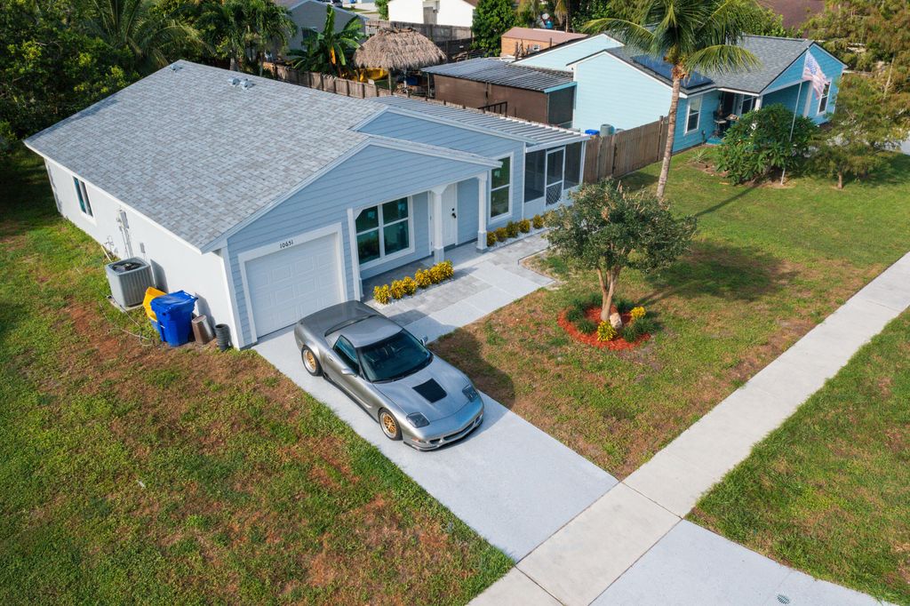 Photo of 10651 Misty Lane, Royal Palm Beach, FL 33411 (MLS # R11117805)