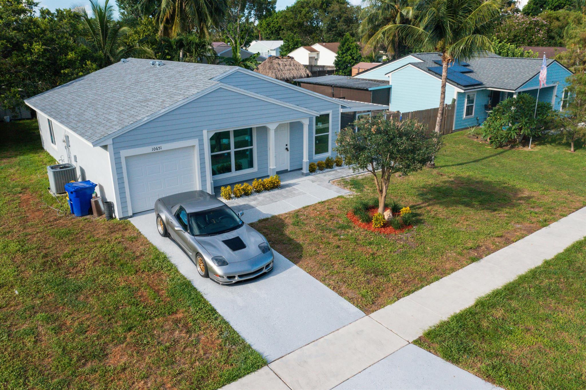 Welcome to your beautifully renovated, No Hoa,3 bedroom, 2 bathroom home, where modern and comfort meets style!! This stunning property features Brand New roof installed in 2025, providing peace of mind with premium insurance rates and enhanced hurricane resistance.Step inside to appreciate the professionally installed Brand New flooring- Waterproof Rigid Core Luxury Plank with Moisture Barrier film - that flows seamlessly throughout the home, complemented by fresh , contemporary paint both inside and out. Both bathrooms have been completely renovated with state-of-the-art finishes that blend elegance and functionality.Brand New hurricane-resistant windows and doors enhance safety and energy efficiency, while a brand new garage doors adds to the home's exceptional curb appeal .