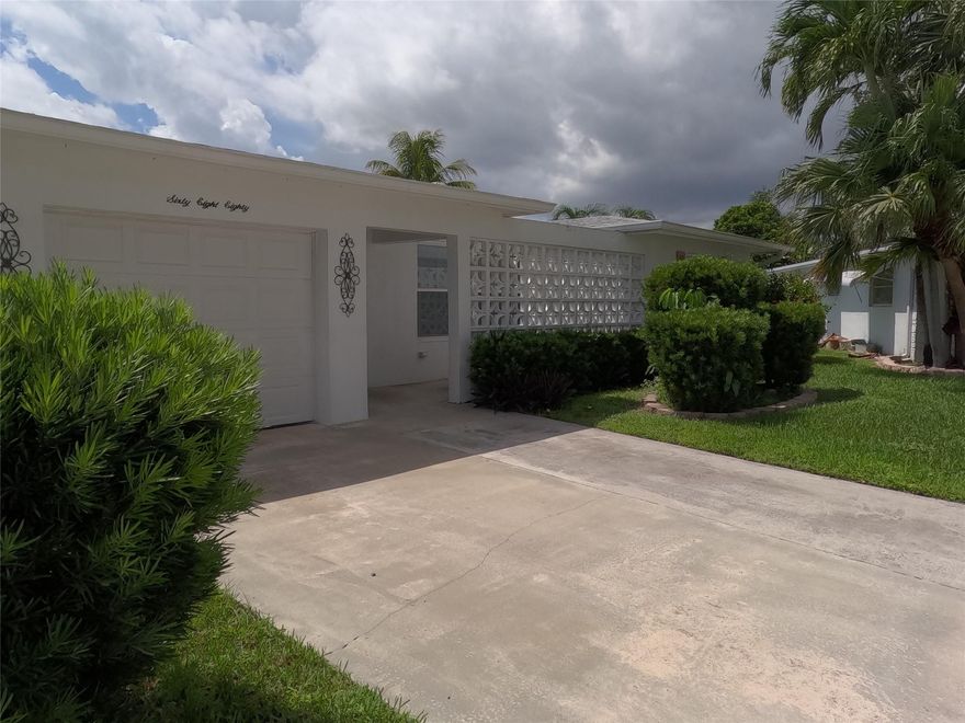 This impeccably maintained home is in excellent condition and ready for its new owners! Situated on a spacious lot in a prime location with beautiful water views, it truly offers the best of comfort and convenience. Featuring impact-resistant windows, a newer roof, tile flooring throughout, and a freshly painted interior, this home is move-in ready. Additional highlights include a new air-conditioning unit, newer stainless steel appliances, a new garage door opener, and walking distance to the clubhouse. Plus Low HOA fee. Don’t miss the chance to see this exceptional property—schedule your showing today!