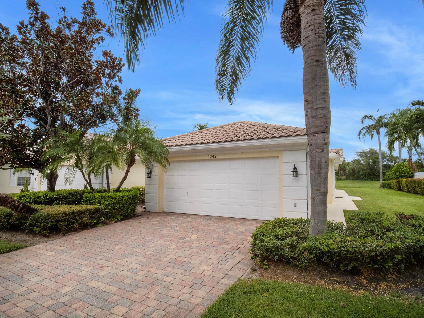 Beautiful Lakefront Villa in The Isles of Palm Beach Gardens!Welcome to this beautifully upgraded 2-bedroom, 2-bathroom villa featuring stunning lake views from a spacious screened-in patio--perfect for relaxing or entertaining. This light-filled home offers a thoughtfully upgraded kitchen, elegant wood flooring throughout, and a convenient inside laundry room. Enjoy peace of mind with a newer A/C and water heater, plus the convenience of a 2-car garage. Located in the highly sought-after Isles of Palm Beach Gardens, this villa combines comfort, style, and an unbeatable location close to everything. Don't miss this exceptional opportunity!