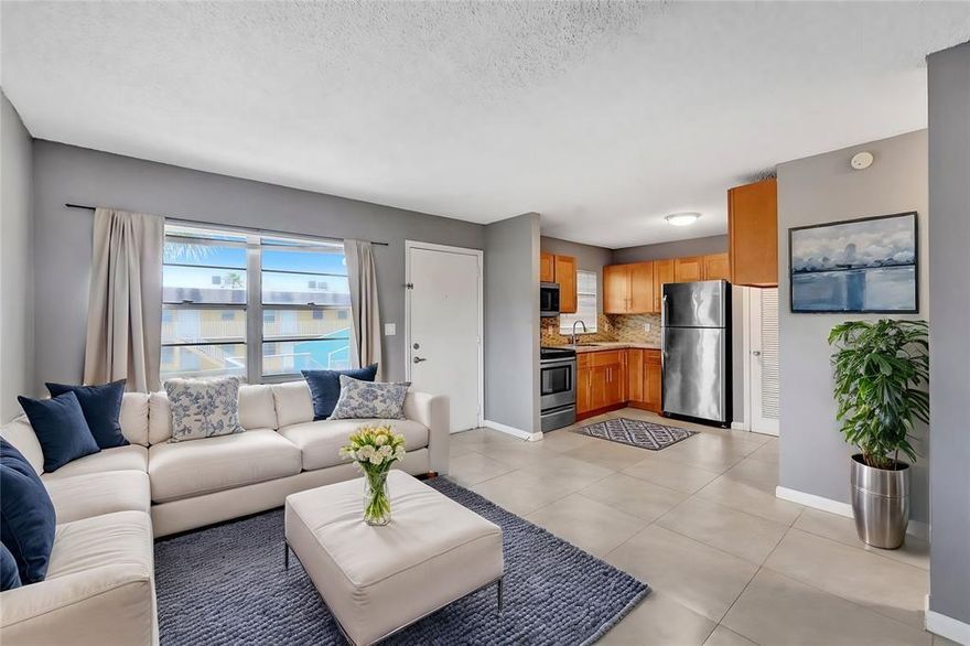 Beautifully remodeled condo east of I-95! This renovated 2-bedroom, 1-bath condo  unit is just minutes from the beach, restaurants, and shopping. Located on the top floor of a well-maintained community, this bright and airy unit offers abundant natural light, stainless steel appliances, granite countertops, and a custom backsplash.
Your assigned parking spot is conveniently just steps from the apartment. Gated community - Amenities include a pool, tennis courts, BBQ areas, walking paths, and plenty of open green space - Gated community