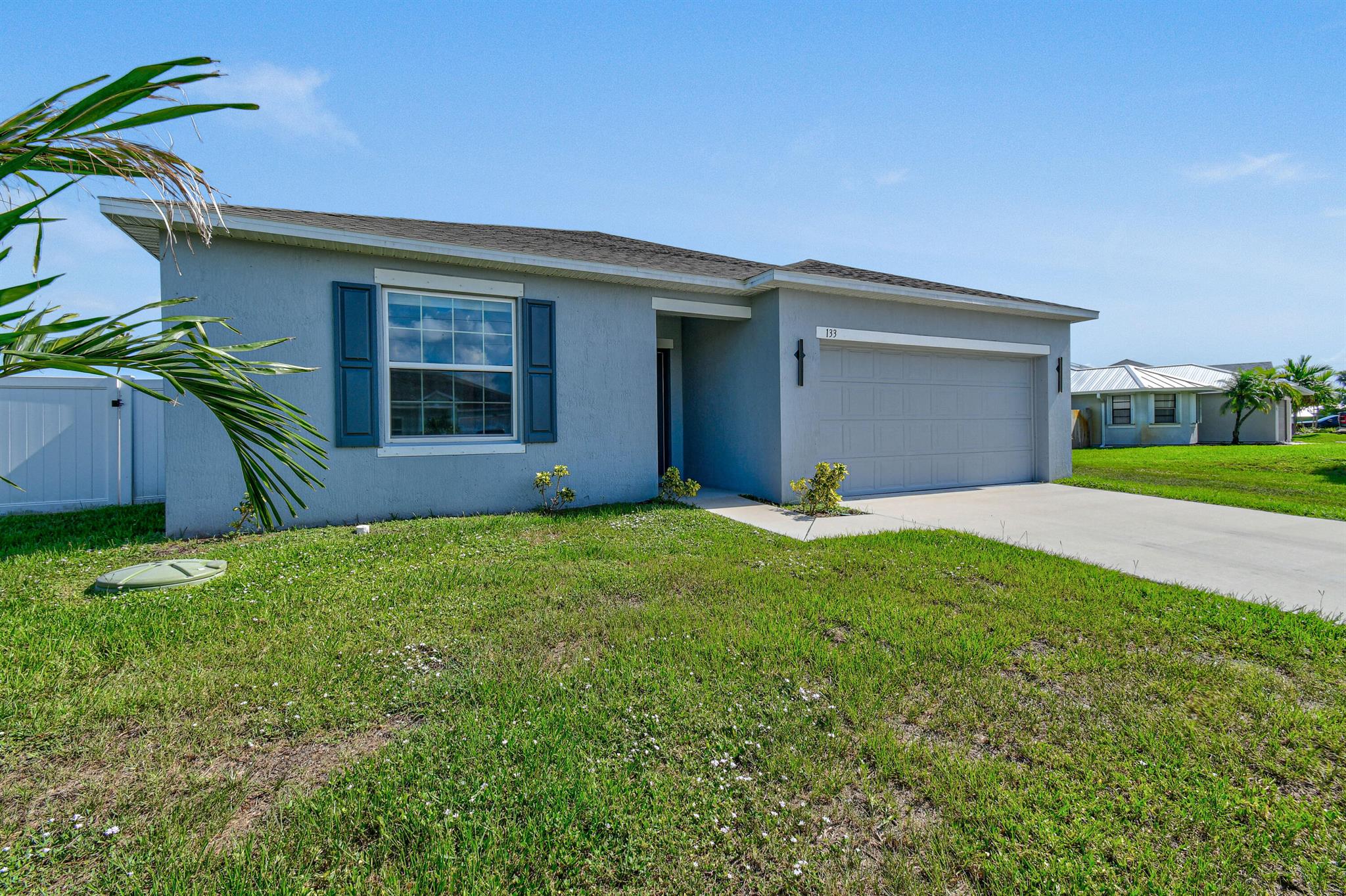 Better than new! This 3-bedroom, 2-bathroom 2 Car Garage CBS home built in 2024 is move in ready. Situated on an oversized corner lot, with screened covered porch, and new fence.Featuring tile flooring throughout, Granite tops, Stainless steel appliances, custom kitchen sink, upgraded window treatments, and custom interior paint.Located in a prime area, this home is close to shopping, schools, and just minutes from both Florida Turnpike and I95.