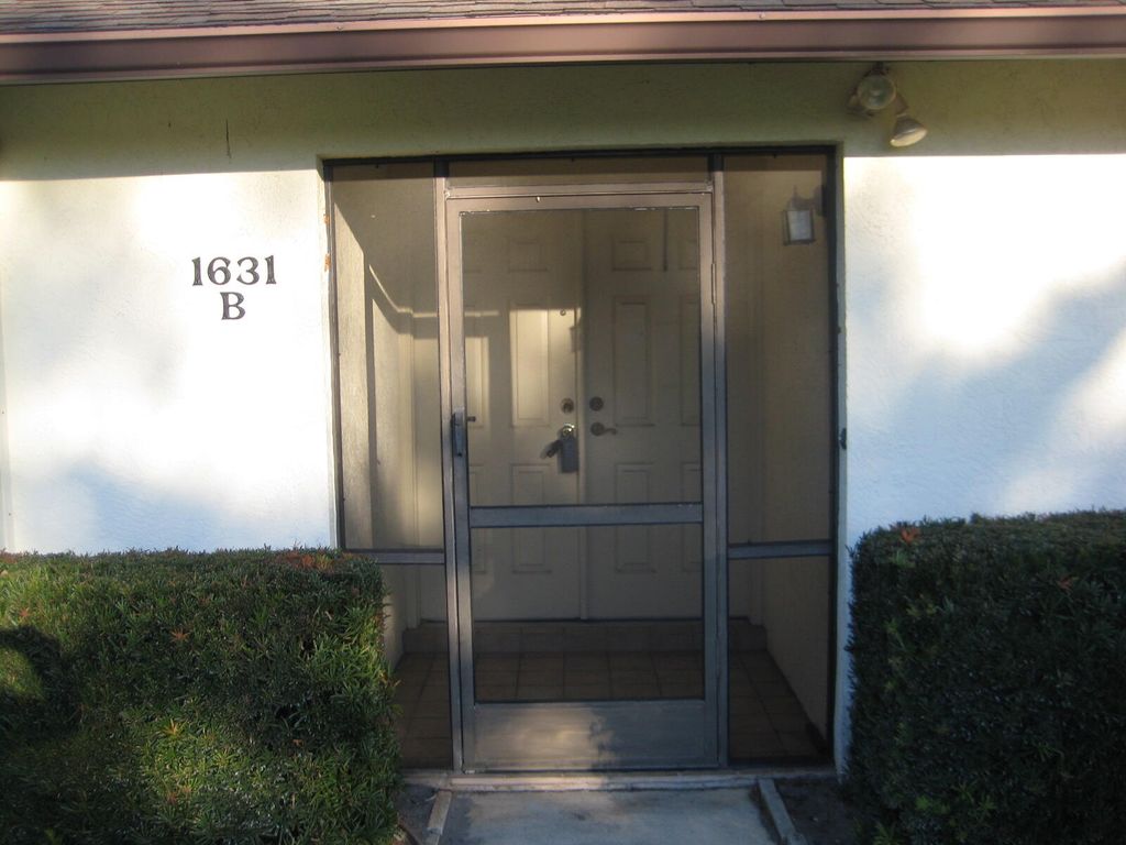 Photo of 1619 Laurel Leaf Ln, Fort Pierce, FL 34950 (MLS # B26000471)