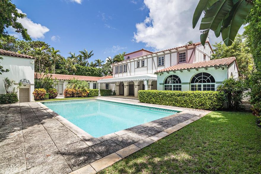 This Landmarked 3 story 6 bedroom 6.5 bath home designed by Maurice Fatio is situated on an oversized lot. Over 7000 square feet of old world elegance. Pecky Cypress library with fireplace, tower guest bedroom, 3 car garage with 2 guest quarters over garage. Lush landscaping and beautiful pool area.