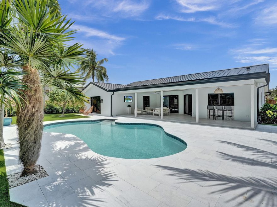 On entering,  you will feel instantly at ''home'', with a sense of calm & relaxation in this exceptional updated, 4 bedroom, 4 bath, luxury Lake Ida residence.  Located just minutes from the Lake & Cornell Park, golf cart to downtown Delray Beach, where you can enjoy the Atlantic Avenue lifestyle  & the beach. This property has attention to detail and designer touches throughout.  Open plan living at its best, the wide plank floors contrast beautifully with the panelled wall with secret door, where a gorgeous  bathroom hides behind.