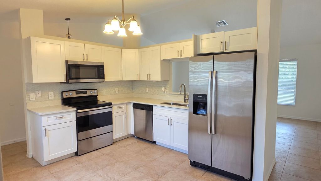 Photo of 1068 SE Prineville Street, Port Saint Lucie, FL 34983 (MLS # R11169716)