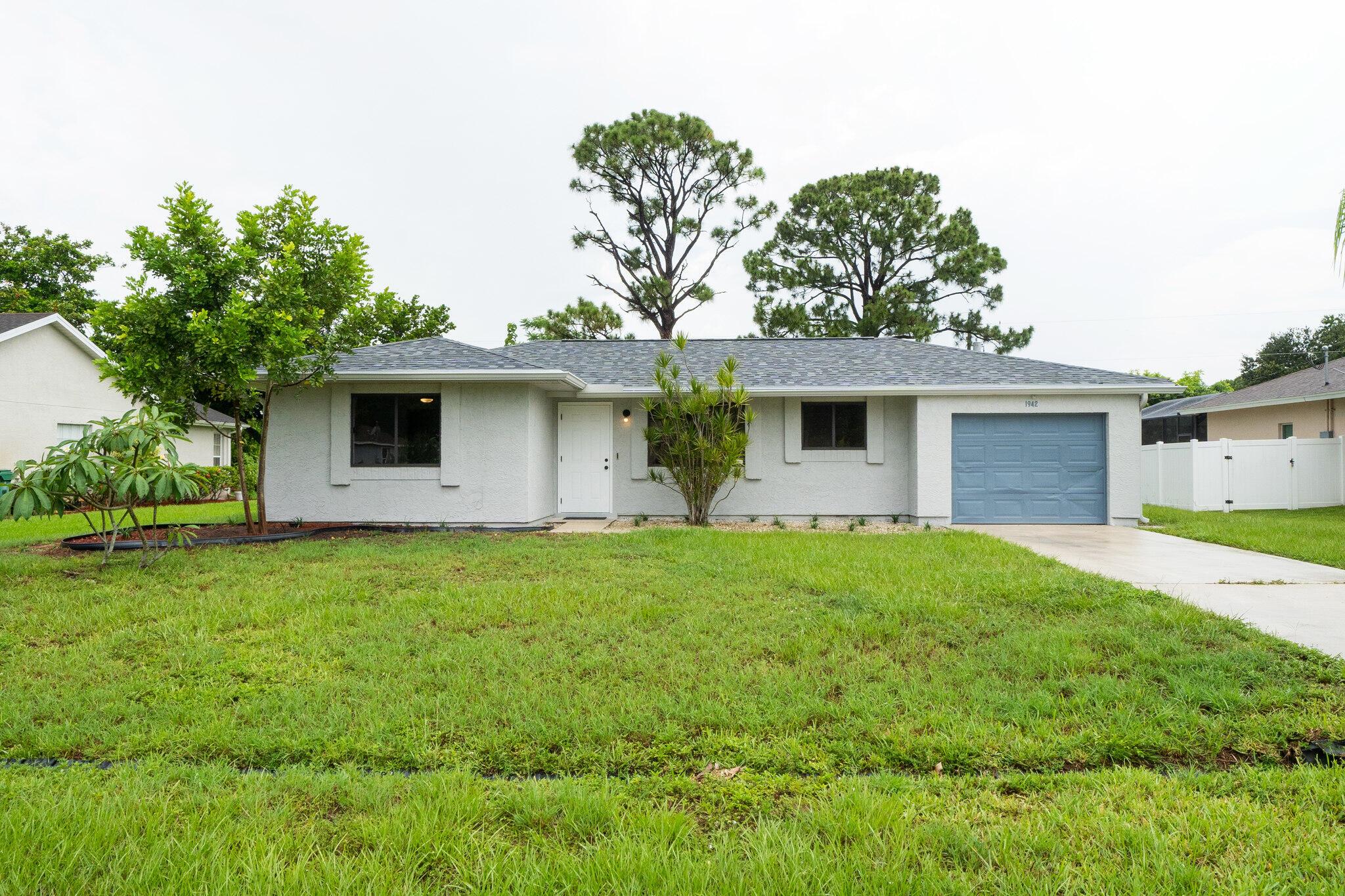 Welcome to this charming 2 bedroom, 1 bathroom home with a 1-car garage, featuring a brand new 2025 roof and a newer A/C unit for year-round comfort. Step inside to find a beautifully remodeled interior with fresh paint inside and out, creating a clean and modern look throughout.The brand-new kitchen is a standout, showcasing stainless steel appliances, sleek cabinetry, and updated finishes. Tile flooring runs through the main living areas, while the bedrooms offer new luxury vinyl waterproof flooring for added style and durability.Perfect as a primary residence or investment property, this move-in ready home won't last long. Schedule your showing today before this beauty is gone!