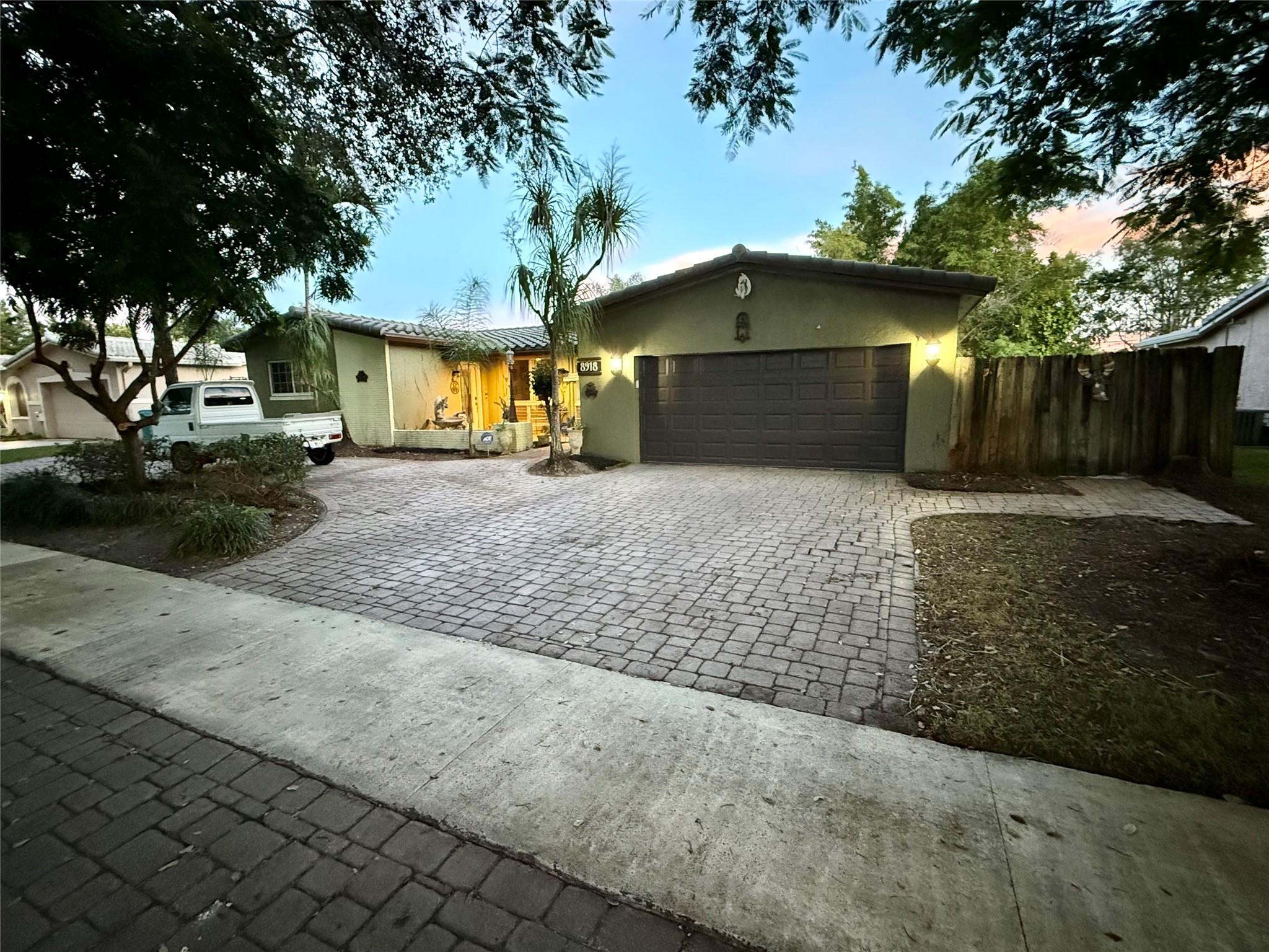 Large Cooper city home on the golf course with oversized lot. Car collectors home has parking for at least 10 cars, 4 covered, two in the garage and two in carport spaces on the side of the house. Large kitchen with granite and stainless appliances. Gas oven and dryer. Lush landscaping with beautiful golf course views. Roof is barrel tile and was done in 2017. A/C was replaced in 2017 as well and just serviced. Impact glass and Miami Dade approved Shutters protect the home in the event of a storm and give you all of the insurance discounts. This is one of the larger homes on the golf course at 2700 ft.² under air and four bedrooms with two bathrooms or could be three bedroom with large office. The home was previously owned by Miami Dolphins football player Don Nottingham.
