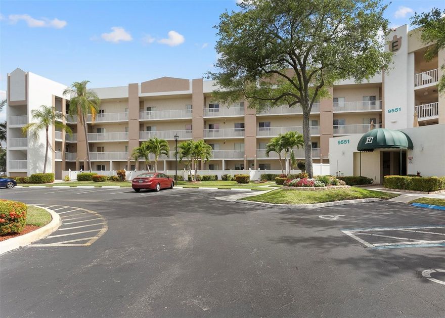 Situated on the top (4th) floor this 2-bed 2-bath residence offers lake and treetop views that set the tone for relaxed South Florida living. Located in the desirable Kings Point 55+ active community the condo features high ceilings and a thoughtfully designed open living and dining space full of natural light. The kitchen includes a cozy eat-in area and an oversized pass-through, ideal for hosting or casual gatherings. A spacious screened balcony extends the living area outdoors, perfect for unwinding or enjoying meals in the fresh air. Unit comes with a washer and dryer and has deeded membership granting access to KP's impressive clubhouse with resort-style amenities & full calendar of activities. A wonderful opportunity to enjoy a vibrant low-maintenance lifestyle in sunny Florida