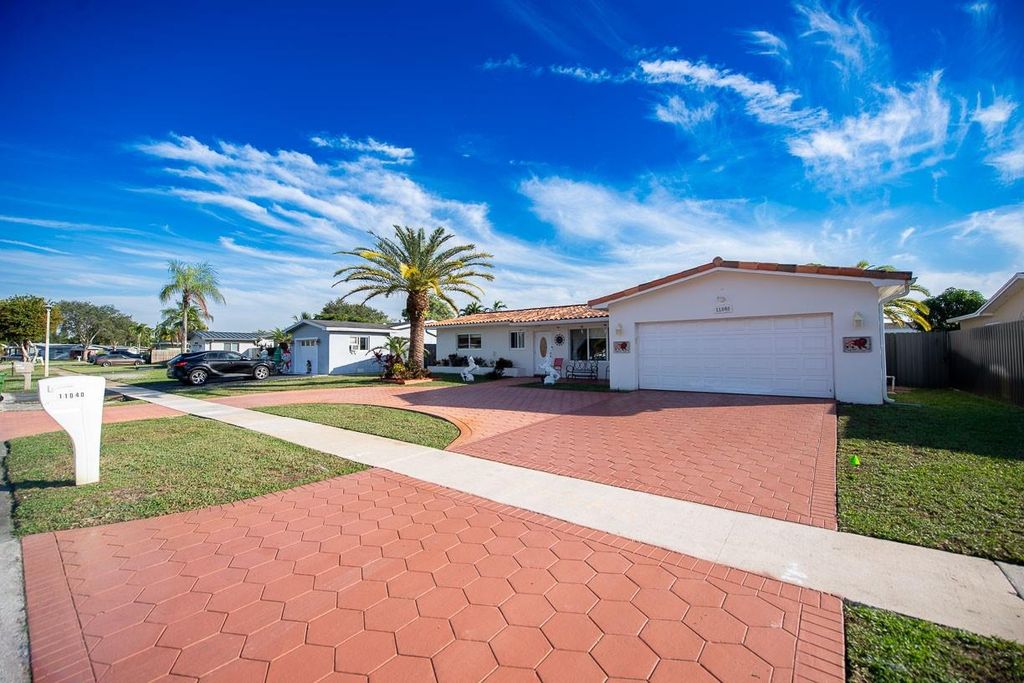 Photo of 11040 NW 16th St, Pembroke Pines, FL 33026 (MLS # F10541168)
