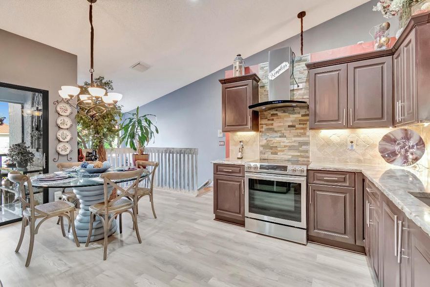 Sun Valley East, 55+ condo community, this 2-bedroom 2-bath, upper-level corner unit was. This unit is one of a kind. Walk into this home, and you will see why. The kitchen has been updated with newer appliances & granite chiseled countertops, all new wood floors throughout only completed not even a year ago, and includes high-end washer/dryer both with steam options.
The living room has a 15-foot stone fireplace with a mantle and is wired for TV. AC has been redone with blue light. The house features a stair chair lift. The HOA covers all maintenance, pool, clubhouse, roadways, and buildings, also includes cable and water, but internet is not included. Hurry, kind unit won't last! FANNIE MAE APPROVED buy it w 5% down