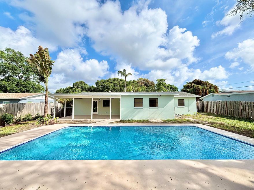 Stunning CBS home in Lake Worth Beach! This beautiful home has 4 beds, 2 baths, 1,672 living sqft, & an oversized 30 Ft POOL!  One of a kind interior features the coveted split bedroom floorplan along with a masterful kitchen complete w/ ivory cabinetry, quartz countertops & stainless-steel appliances. Luxury vinyl flooring w/ 5in baseboards. Large master suite features a walk-in closet & gorgeous bath with dual sinks. Guest bath nicely updated. Sunroom leads to a covered patio overlooking the pool & an oversized, fenced, backyard - perfect for entertainers & sun bathers. Additional features include a built-in sound system, newer Roof & AC (2021, 2020), dedicated Laundry Room, & more! Listing subject errors, omissions, & change without notice. Room Measurements approx. See it today!