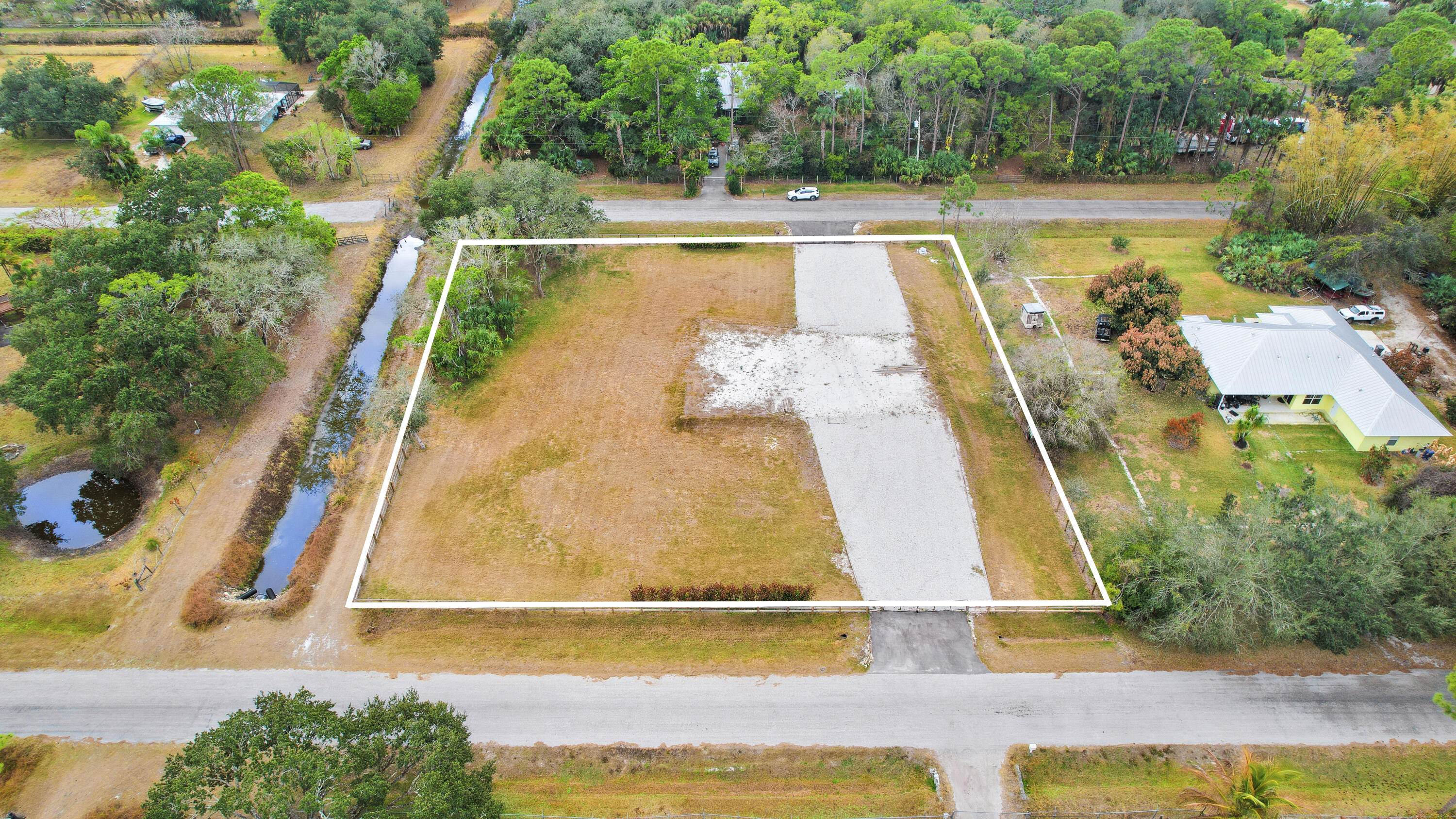 THE ACREAGE - Land