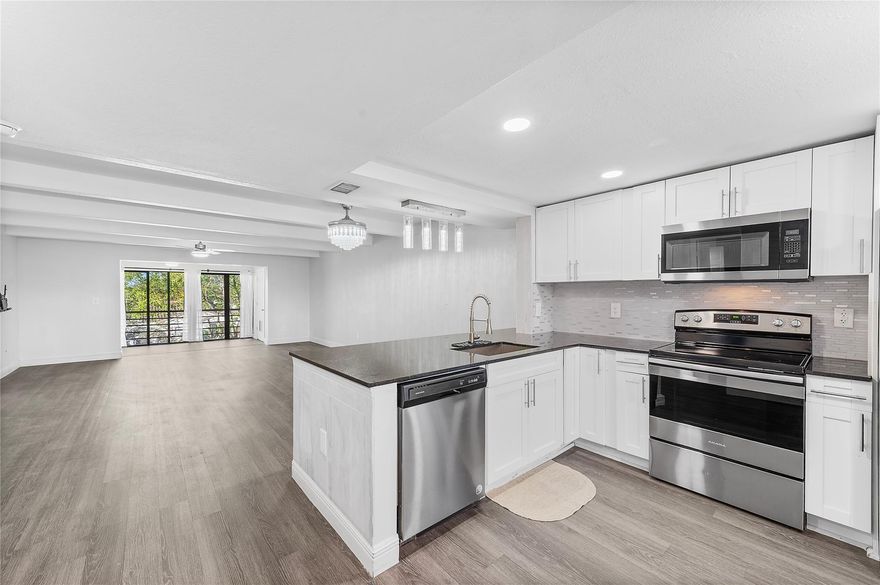 Fully upgraded and beautifully maintained 2-bedroom, 2-bath condo on the 4th floor of a well-kept building with convenient elevator access, offering 1,255 sqft of bright, comfortable living. Freshly painted with new A/C, upgraded LED lighting, and ceiling fans throughout. The kitchen features granite counters, custom storage, and stainless steel appliances. In-unit washer and dryer with steam and wrinkle guard. Both bathrooms include luxury rainforest shower panels. The enclosed patio provides a perfect home office or bonus flex space. Enjoy resort-style amenities including a clubhouse, fitness center, two pools, dog wash, car care area, and kids’ play area. Two assigned parking spaces plus guest parking. Close to shopping, schools, and hospitals.