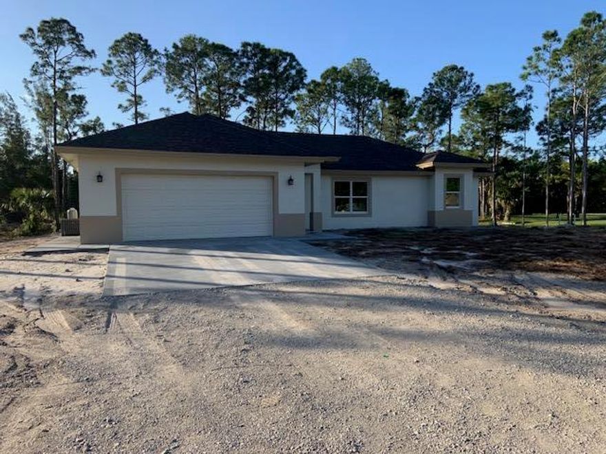 Appraisers: No seller concessions. Another quality built home by local builder! Great location for this brand new home - just 3 lots from pavement on a nice lot - no pond.  Granite counters in kitchen, and baths. SS Frigidare appliances.  Cabinets have self close drawers, and roll out shelves in pantry.  There is also a spice cabinet, and lazy susan!  Impact windows, and wood look tile throughout.  Ceiling fans in all rooms, and inside laundry. Master b/r has a tray ceiling, crown molding, and a huge closet!   Fixtures in baths and kitchen all match and are upgraded (not Chrome). 9 ft. ceilings in all rooms except living, where they are vaulted.  Very open floor plan., with a large patio under truss. Builder supplies water system, and lays 10,000 sq. feet of sod (after contract). Own a bra