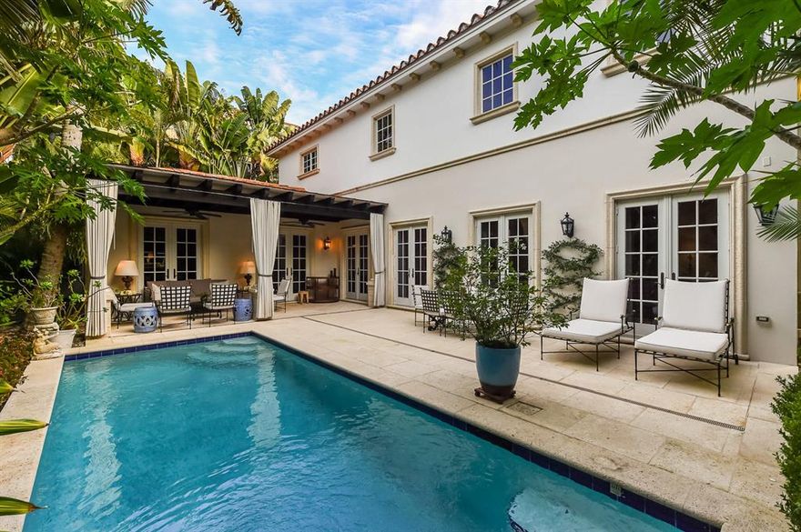 Find your safe haven in Palm Beach.  Move-in-ready and an excellent value just one block to the ocean and lake trail, this impeccably maintained four bedroom, five and half bath residence is close to town, shops, beaches and the bike trail. This designer's Mediterranean style home offers a beautifully appointed chef's eat-in kitchen with granite counters, stainless steel appliances and a gas range. The spacious living room, dining room and kitchen, all with 10 foot ceilings, offer French doors opening to the pool and loggia, melding the inside with the outdoors. The lush and mature landscaping ensure supreme privacy. The master suite is a spa-like retreat with dual baths and two full walk-in closets. The residence is completed by a home office/4th bedroom, a fireplace, a two-car garage and