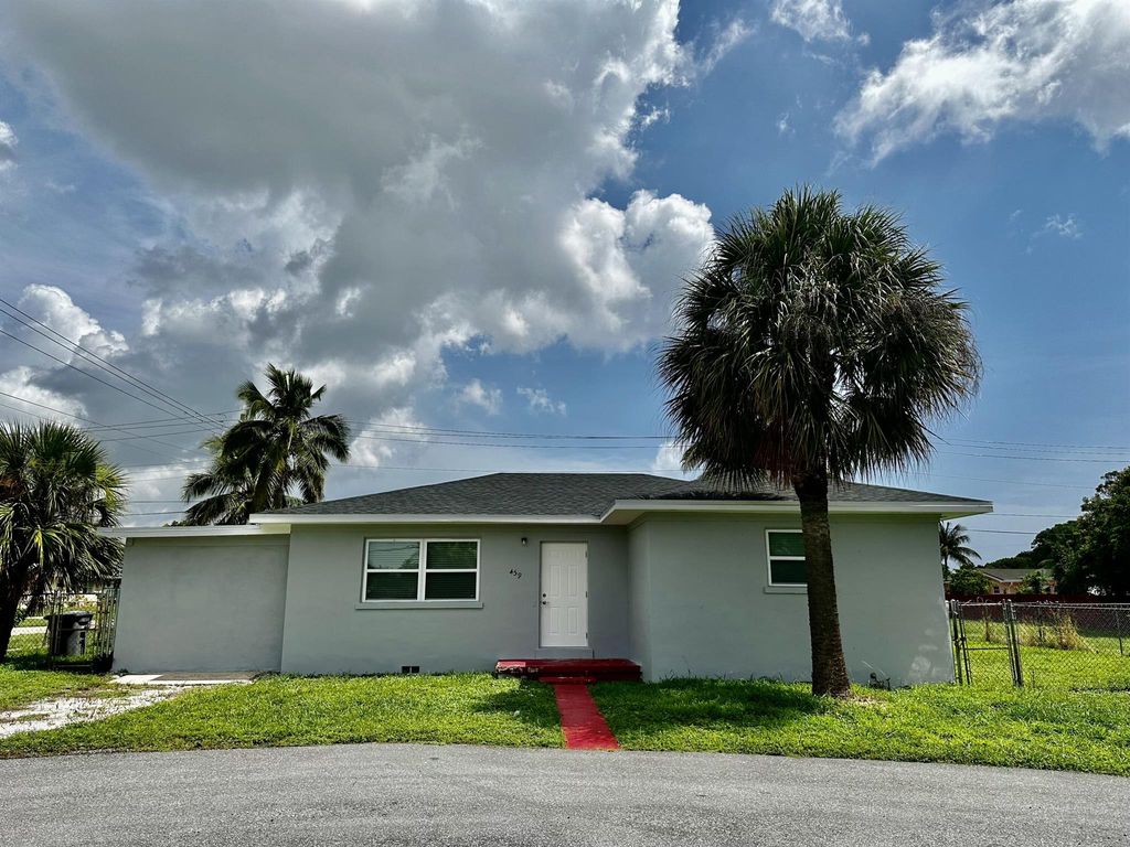 Photo of 459 Silver Beach Road, Lake Park, FL 33403 (MLS # R10903834)