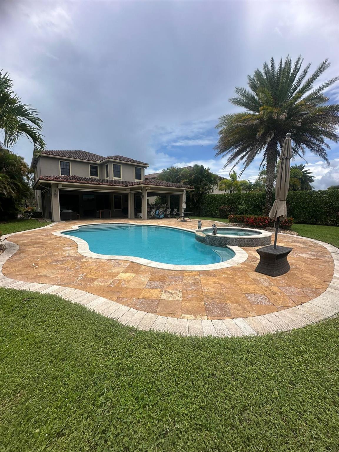 This Bright and Stunning 5 Bed 4 Bath Home, with 3 car garage, located on an oversized lot larger than surrounding properties, over $300k in Upgrades, Impact windows, 2 A/C Unit system with Infrared germ and mold protection; enjoy the Private Salt Water heater Pool w/Jacuzzi, perfect for relaxing or entertaining, along with a gorgeous outdoor BBQ area w/retractable screens all over, built for gatherings with family and friends, the property is enclosed with a fence combining security and functionality with style. The schools are recognized for their high quality and excellence in academic results. Don't miss the chance to own this extraordinary property.
