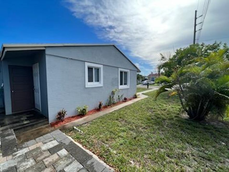 WELCOME TO LAKE WORTH BEACH.BEAUTIFUL CORNER HOME 3 BEDROOMS 2 BATHROOMS COMPLETELY REMODELED, IMPACT WINDOWS AND DOORS, 5 YEAR OLD A/C, NEWER KITCHEN CABINETS, UPDATED BATHROOMS , 10 YEARS OLD SHINGLE ROOF, KNOCK DOWN CEILING, BIG MANGO TREE WITH NICE SHADE IN THE BACK YARD. CERAMIC TILES IN MAIN LIVING AREA, LAMINATE FLOORING IN MASTER BEDROOM,VINYL PLANK FLOORING IN THE TWO FRONT ROOMS,NEWER TANK-LESS WATER HEATER  PROPERTY WITH GREAT POTENTIAL, SEPARATE ENTRANCE ON MASTER BEDROOM THAT CAN BE EASILY CONVERTED INTO A 1 BEDROOM APARTMENT FOR ADDITIONAL INCOME. GREAT BACKYARD FOR PETS/BOAT. CLOSE TO ALL SCHOOLS, WALGREENS, PUBLIX,PUBLIC GOLF COURSE NEAR BY. NO HOA, NO PET RESTRICTIONS.GREAT FOR FIRST TIME BUYERS AND INVESTORS.