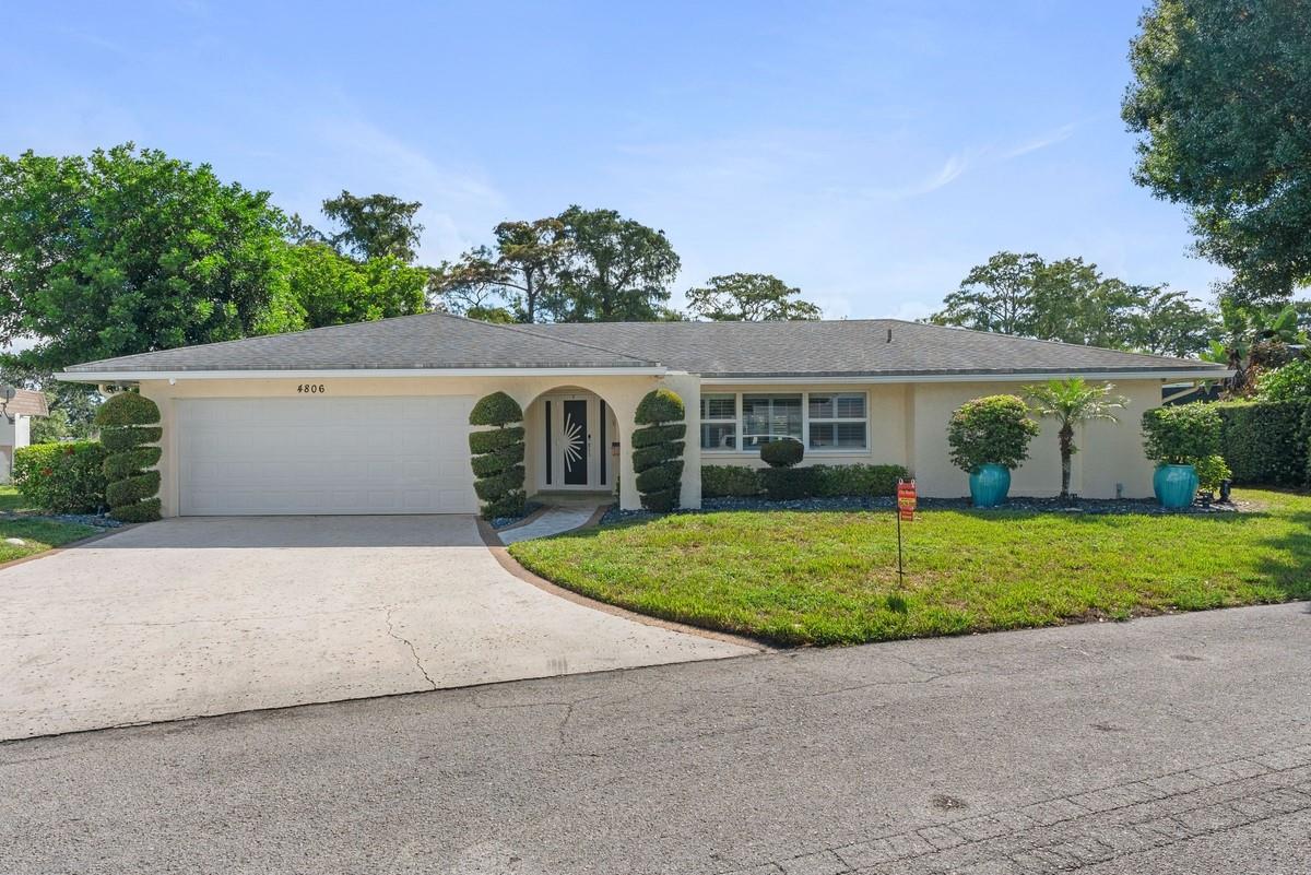 Beautifully remodeled 3BR/2BA pool home in the desirable Woodlands community! This home backs to lush greenery, offering peaceful views and total privacy. Step outside to a custom pool with travertine patio and a spacious covered area—ideal for outdoor living. Inside, enjoy an open layout with formal dining, large living room, and oversized family room. The kitchen features granite counters, stainless steel appliances, and ample cabinetry. Split-bedroom design, impact windows/doors, and a 2019 roof. Conveniently located minutes from shopping, dining, parks, and everyday essentials. Spacious bedrooms, updated baths, and generous closets provide both comfort and style.