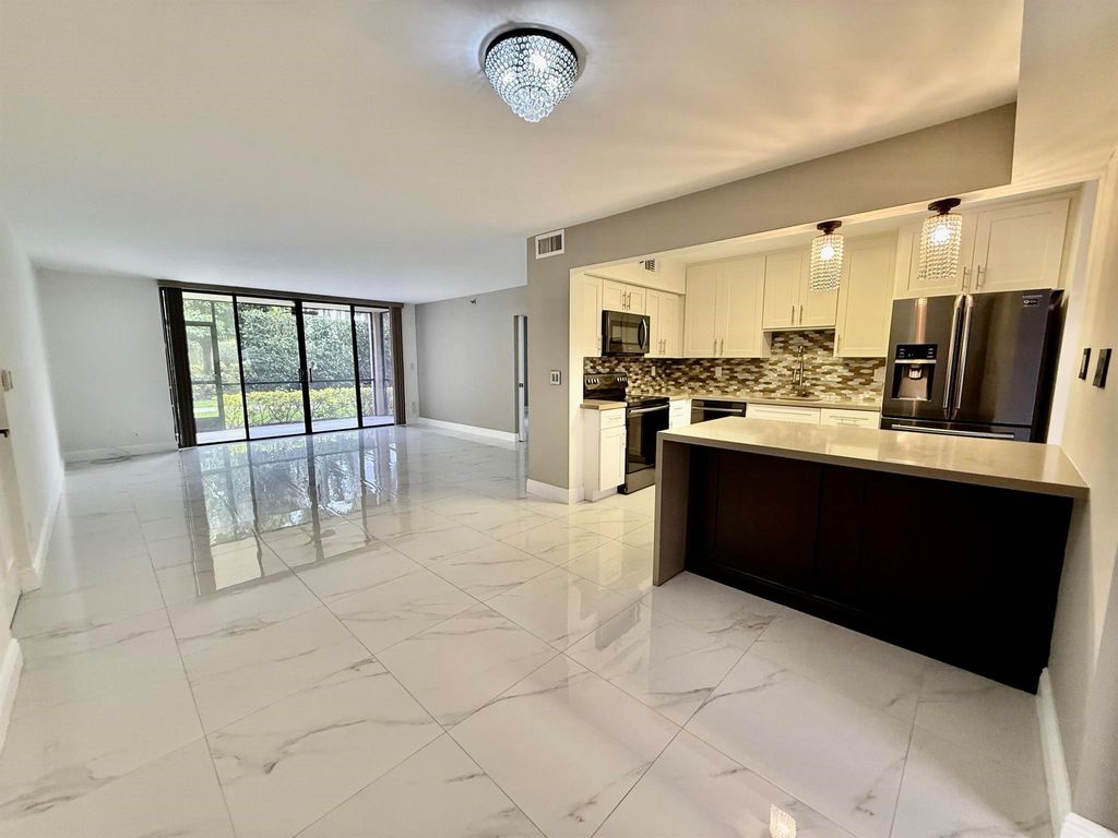 Photo of 7564 Regency Lake 102 Drive #102, Boca Raton, FL 33433 (MLS # R11072146)