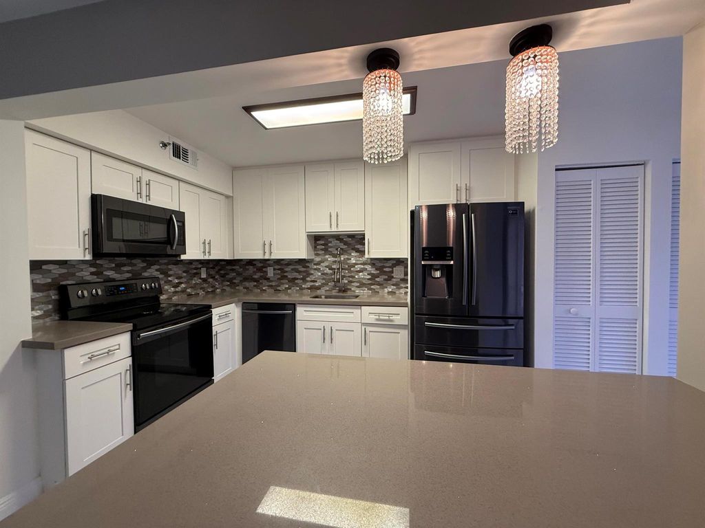 Photo of 7564 Regency Lake 102 Drive #102, Boca Raton, FL 33433 (MLS # R11072146)