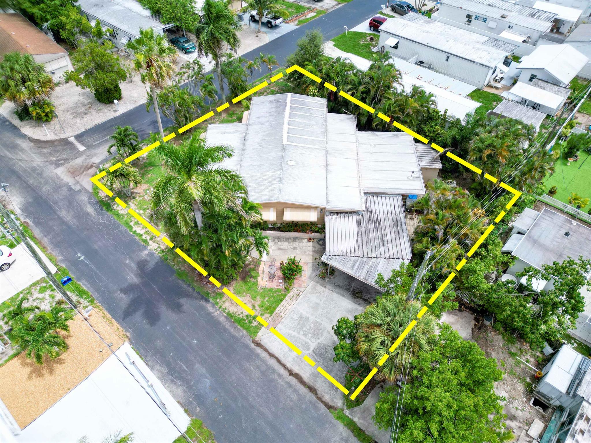 Move-in ready and perfectly situated in a vibrant 55+ community, this spacious 2-bedroom, 2-bath manufactured home in Boynton Beach offers comfort, convenience, and exceptional value. Nestled on one of the community's largest double lots, the property features a generous backyard ideal for gardening, outdoor living, or entertaining. Inside, you'll find a large floor plan designed for easy living, while outside a carport and detached laundry/storage area add everyday functionality. With water included in the HOA and incredibly low dues of just $100 per month, this home combines low-maintenance living with affordability. Whether you choose to enjoy the existing home as-is, renovate to your style, or start from scratch with a brand-new build, this property presents endless possibilities in