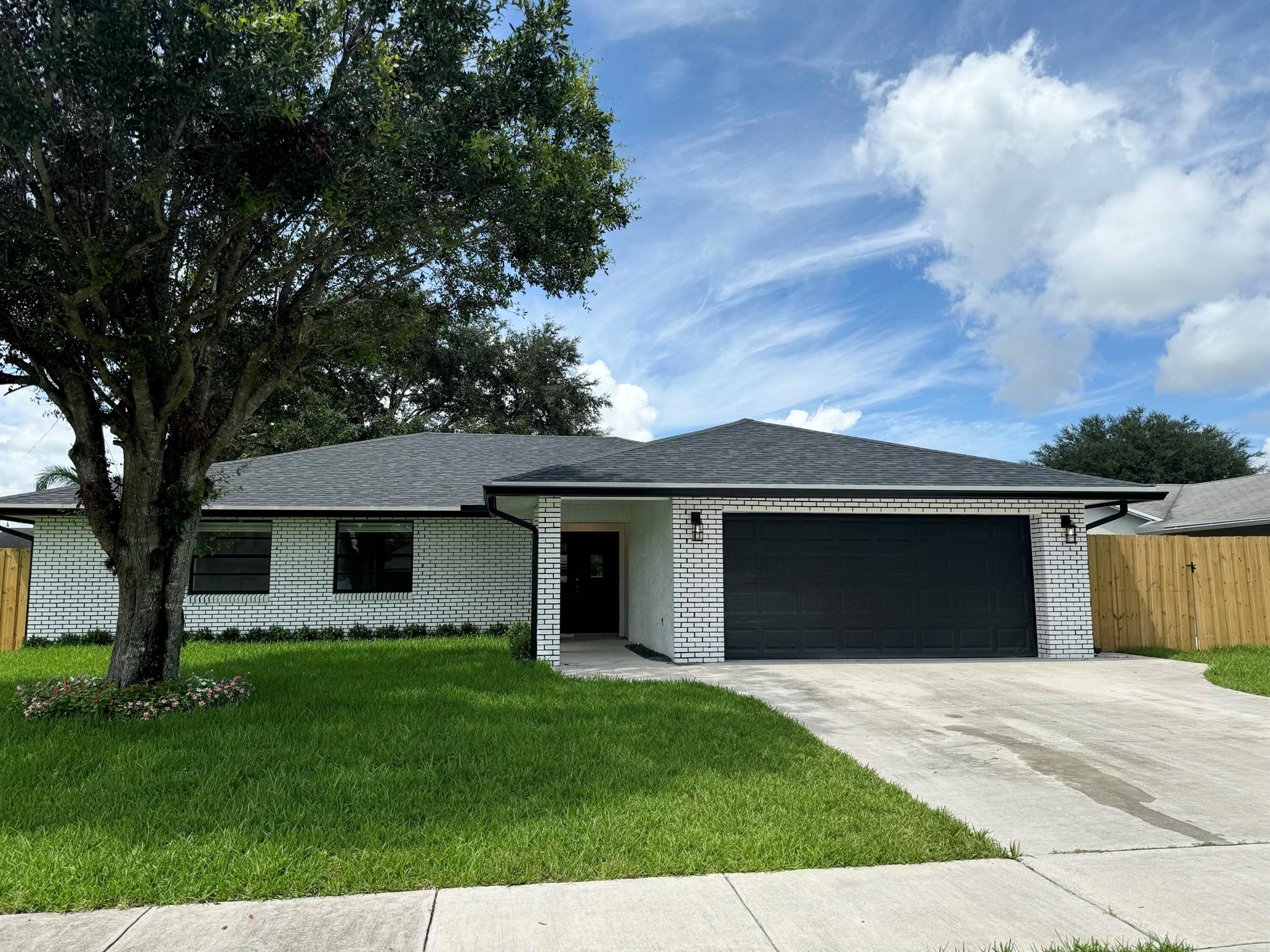 This beautifully remodeled 3 bedroom home is move in ready! Brand new kitchen, bathrooms, tile floors, recessed lighting, and freshly painted walls. Stunning curb appeal with a 2 car garage. Huge turfed backyard and screened in patio for afternoon lounging! Truly a place to call home on a quite street. Close to all shops and restaurants!MOVE IN IMMEDIATELY! There is a paved space on the side yard to store your boat or RV for an extra $250 a month.