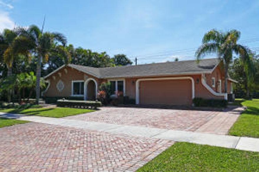 ITS A WOW.  TOTALLY UPGRADED AND BEAUTIFULLY LANDSCAPED 4 BEDROOM SPLIT  FLOOR PLAN HOME WITH RESORT POOL AND PATIO AREA.  NO REAR NEIGHBORS.  VAULTED CEILINGS IN LIVING AND DINING ROOM.  IMPACT WINDOWS. FABULOUS KITCHEN.  BEAUTIFUL WOOD FLOORS THROUGHOUT.  SUMPTUOUS MASTER SUITE WITH DOUBLE SPA TUB, SEPARATE SHOWER AND A 9FT X 8FT WALK IN CLOSET. NEW ROOF 2014. NEWER A/C. EXPANDED 3 CAR PAVED DRIVEWAY. SEE ADDENDUM FOR UPGRADES, ETC. A RATED SCHOOLS.  RARELY DOES A HOME OF THIS QUALITY COME ON THE MARKET.  SHOWN BY APPOINTMENT.  CALL NOW