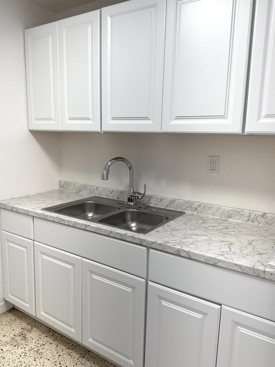 Updated apartment with 2 bedrooms 1 bathroom. This well-kept apartment is approximately 547 sqft under air. Freshly painted and nicely updated with ductless AC units, terrazzo or ceramic flooring throughout the entire unit, wood cabinetry in the kitchen, appliances are not included.