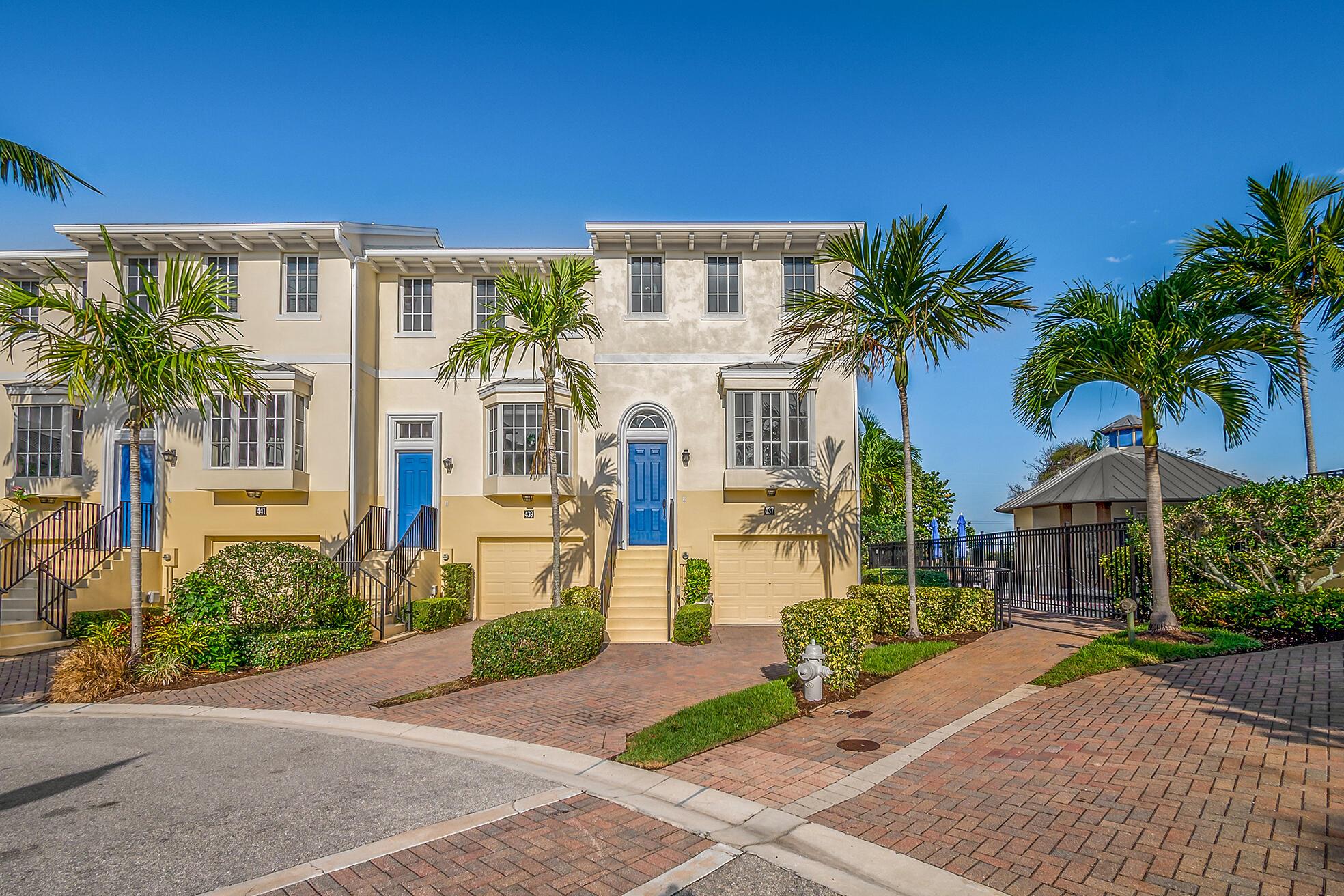 Wake up to ocean breezes and coastal charm in this stunning, move-in-ready furnished or unfurnished end-unit townhome in the highly sought-after Juno Dunes community. This meticulously maintained residence is loaded with upgrades, including rich wood flooring, solid wood cabinetry, granite countertops, stainless steel appliances, hurricane impact windows, and automated window treatments throughout. The spacious master suite features a recently renovated bathroom with modern tile flooring, quartz countertops, new cabinetry, a frameless glass shower, and a relaxing jacuzzi tub.