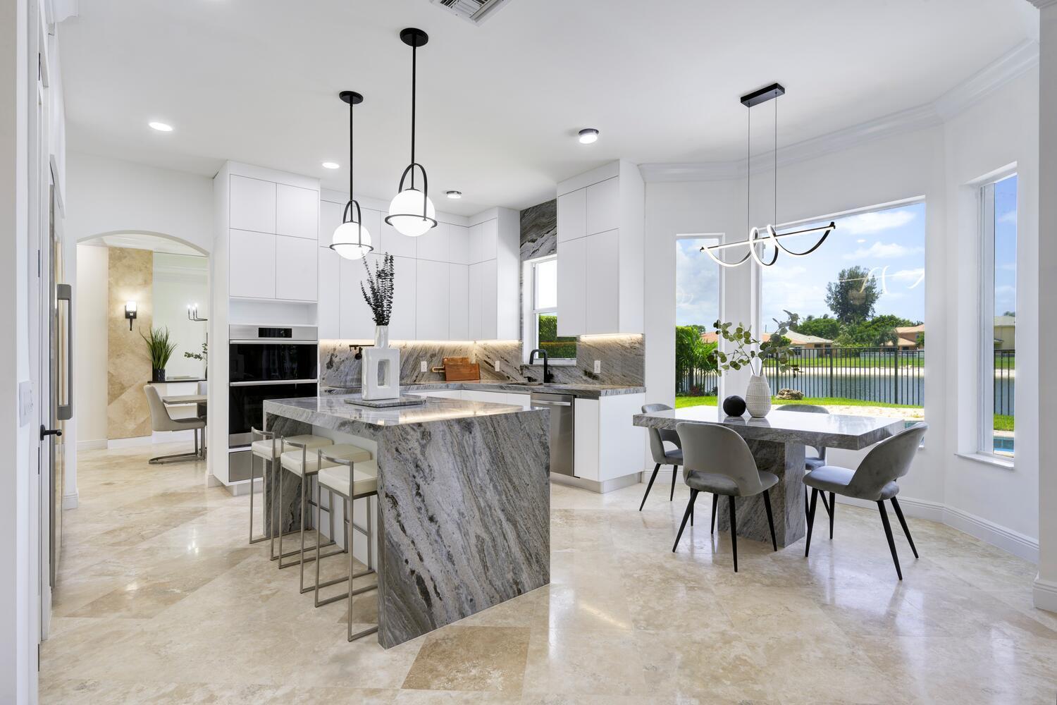 This Luxurious two‑story home offers a turnkey masterpiece--architectural design with resort-inspired spaces. Upscale interior finishes, and community perks like tennis, pickle ball, close proximity to golf courses and Palm Beach lifestyle. Spacious open floor plan with 5 bedrooms, 3 full bathrooms and 1 half bath, office and theater. Gourmet kitchen equipped with waterfall‑edge quartzite countertops, center island, high-end appliances, and walk‑in pantry. Luxurious master suite features an ensuite bath with double vanities, large format tiled shower, a soaking tub, and custom walk-in closets. Whether you're dreaming of a family retreat, entertainer's haven, or a place to call home, this property offers a compelling package of elegance and functionality. 24 hour manned