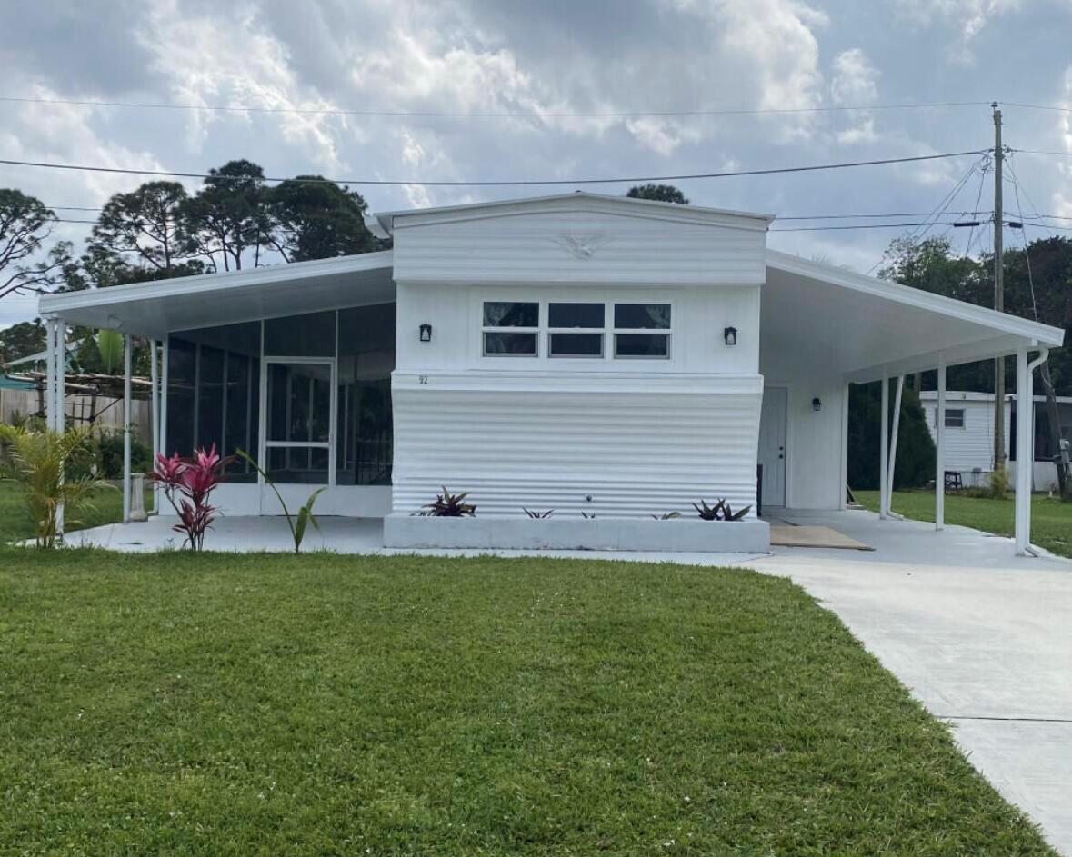 Look no further than this hidden gem located in Stuart in a quiet residential community. NO HOA. The entire home has been renovated with a new Electrical system, new insulation, new Plumbing throughout with new Water Filtration system, pump and heater. Custom carpentry featuring white custom cabinetry, quartz countertops, island with stainless steel sink, marble back splash and new stainless steel appliances. A new bathroom with a large vanity, private half bathroom, along with extra closet space, high quality vinyl waterproof flooring throughout, and freshly painted. Large screened in patio and two covered porches, ideal for entertaining. Large storage space with washer/dryer hookup, workshop/shed. Quiet neighborhood with a convenient location close to shopping, dining, beaches and more