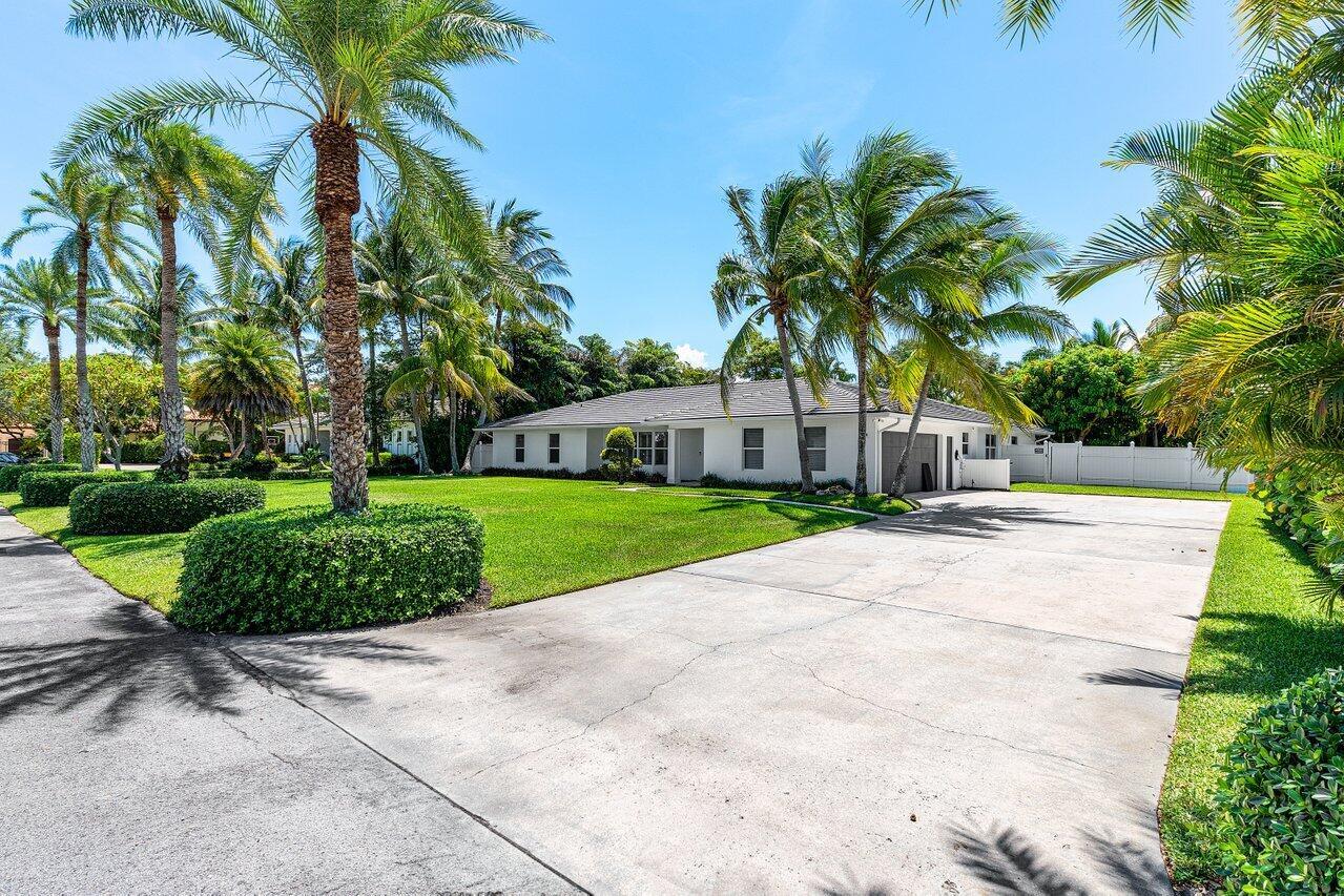 Located in the highly sought-after Lake Ida neighborhood, this beautifully updated home offers a spacious and open split floor plan with 5 bedrooms and 3 bathrooms. Set on a generous 19,000 sq ft lot on a quiet cul-de-sac, the property is within walking distance to one of Delray's top private schools--a fantastic bonus. The fully renovated interior features neutral tones, Italian-imported flooring, and a stunning kitchen with a large leathered quartzite island and light-washed wood cabinetry. Additional highlights include a recently renovated pool, a newer cement tile roof, impact glass windows, and updated plumbing and electrical systems. This is only the second time the home has been offered for sale--a rare opportunity to own a classic Florida gem.