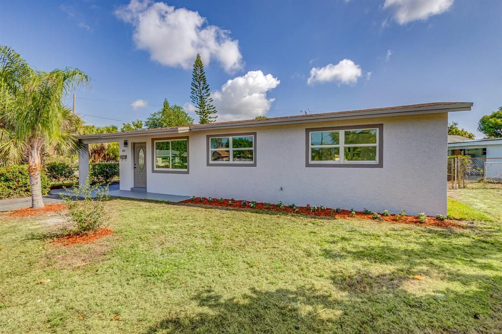 Photo of 855 Date Palm Drive, Lake Park, FL 33403 (MLS # R10877454)